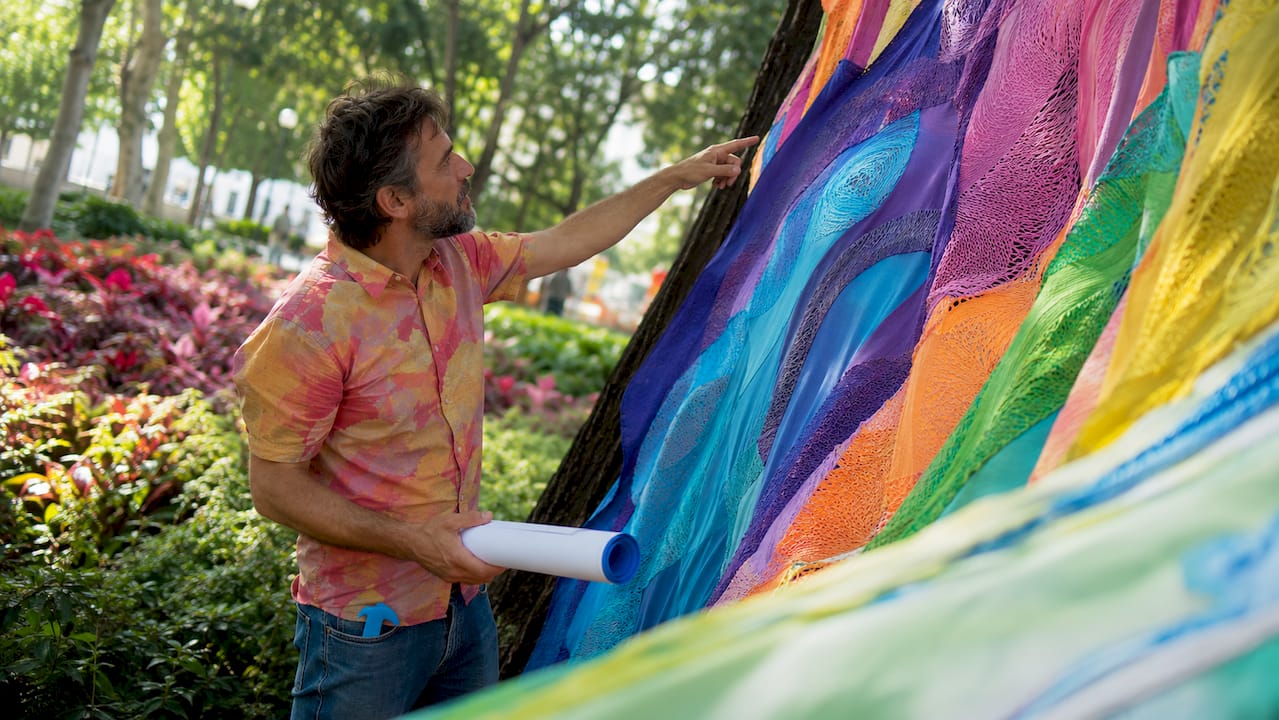 Artist setting up large-scale outdoor art installation