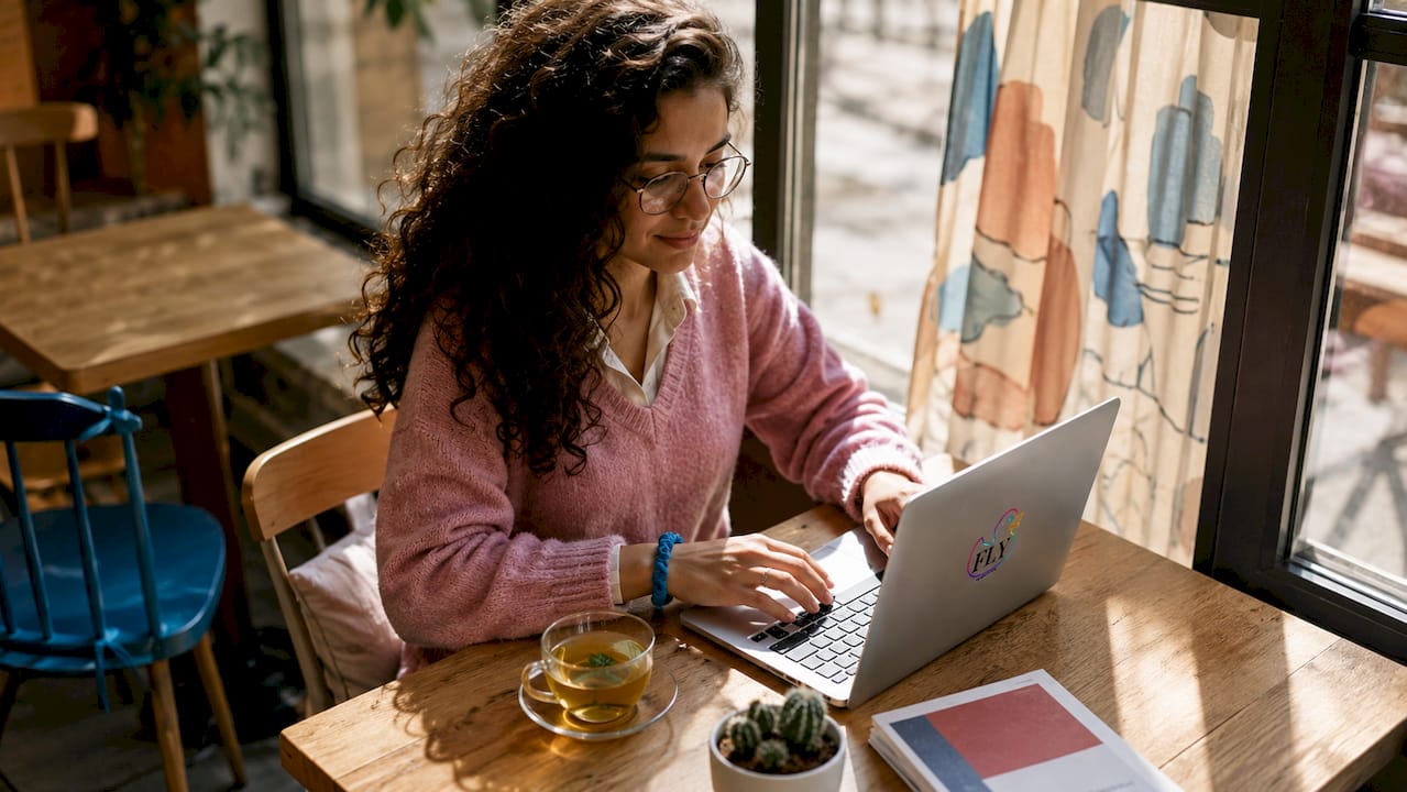 Woman browsing art gallery website at home
