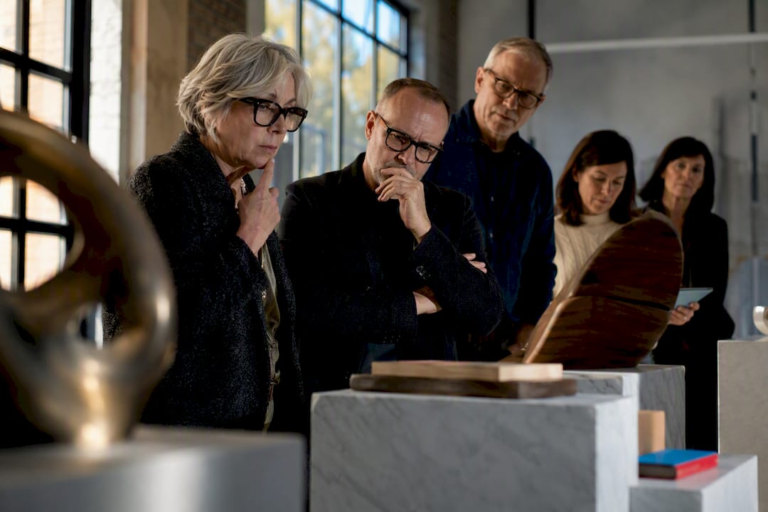 Jury reviewing public art maquette details