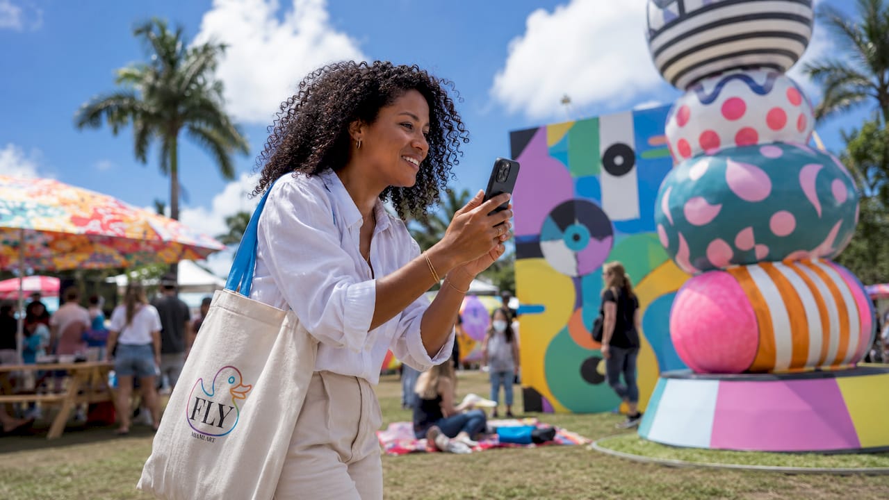 Visitor walking in immersive pop art exhibit