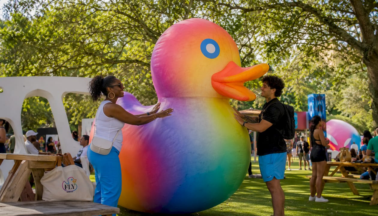 People engaging with inflatable civic art sculpture